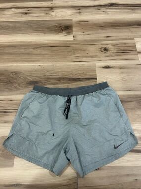 Nike Light gray 5 inch running shorts.